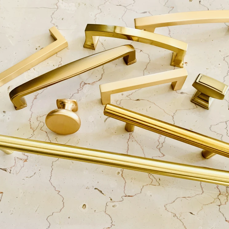 Gold and brass and brushed gold and brushed brass cabinet knobs and cabinet pulls. 