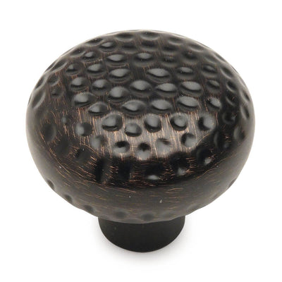 Round cabinet knob in oil rubbed bronze finish with golf ball texture Cosmas 10551ORB Oil Rubbed Bronze Round Craftsman Cabinet Knob