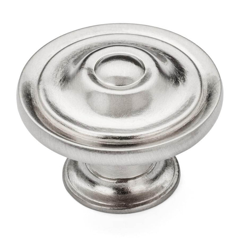 Cabinet drawer knob in satin nickel finish with one and three eighths inch diameter with an embossed ring