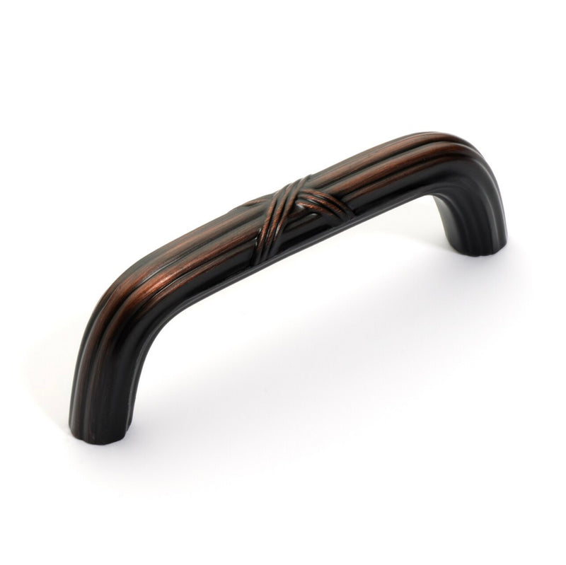 Cabinet handle pull in oil rubbed bronze finish with ribbon design on the face and furrow design