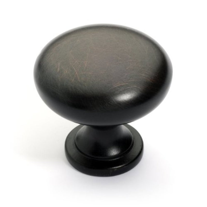 Basic round cabinet knob with one and three sixteenths inch diameter in oil rubbed bronze finish