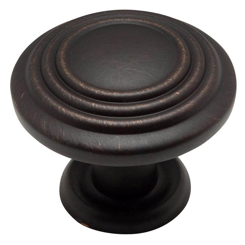 Round cabinet drawer knob in oil rubbed bronze finish with three raised rings on the face