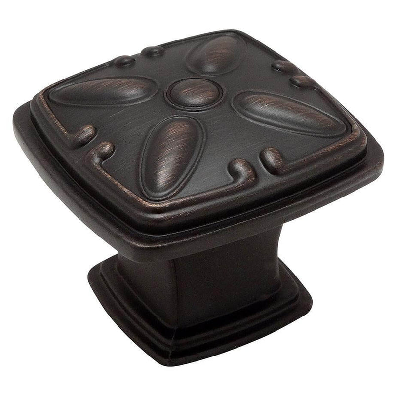Square drawer knob with embossed decorations on the face 