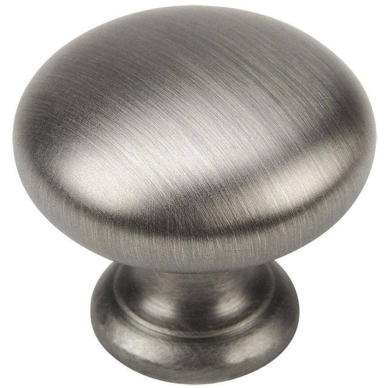 Basic round cabinet knob in antique silver finish with solid base and one and a quarter inch diameter