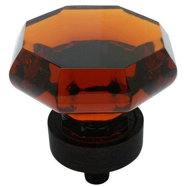 Diamond shaped drawer knob in oil rubbed bronze finish with amber glass and one and a quarter inch diameter