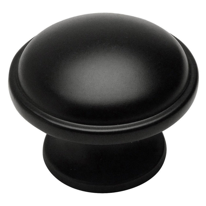 Flat black cabinet knob with exceeding edges and one and three eighths inch diameter