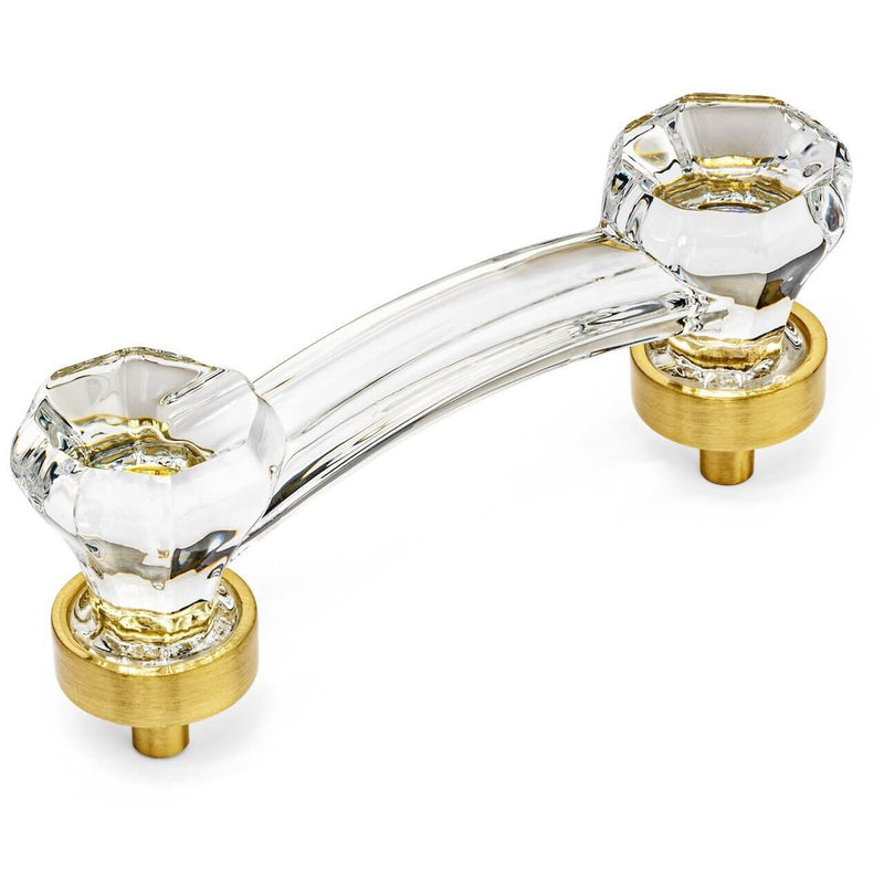 Clear glass cabinet pull in brushed brass finish with three inch hole spacing and diamond rock shaped ends