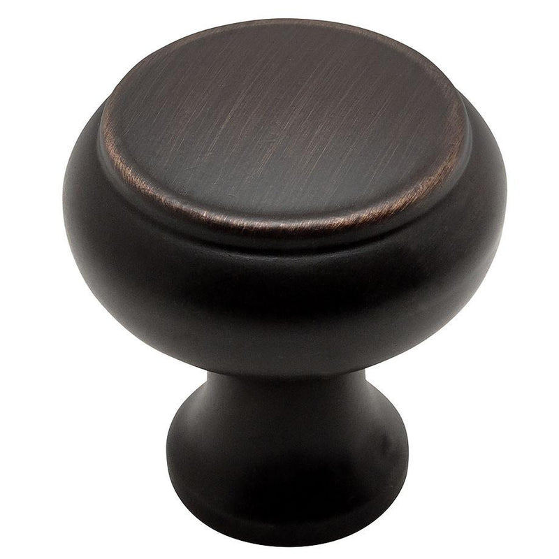 Drawer knob in round shape and oil rubbed bronze finish with raised centre design
