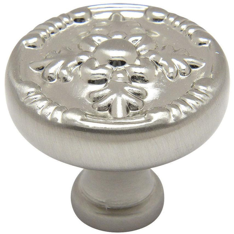Satin nickel cabinet drawer knob with tree shaped carving on the face