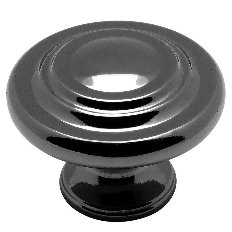 Round cabinet knob in black nickel finish with two raised rings on the centre and thicker subtle edges