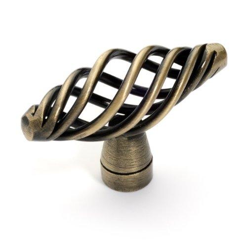 Croissant shaped birdcage drawer knob in antique brass finish with two and one eighth inch length