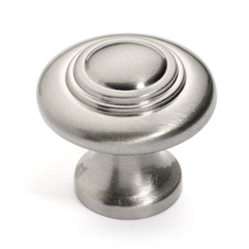 Dynasty knob in satin nickel finish with concentric design and a small head at the center