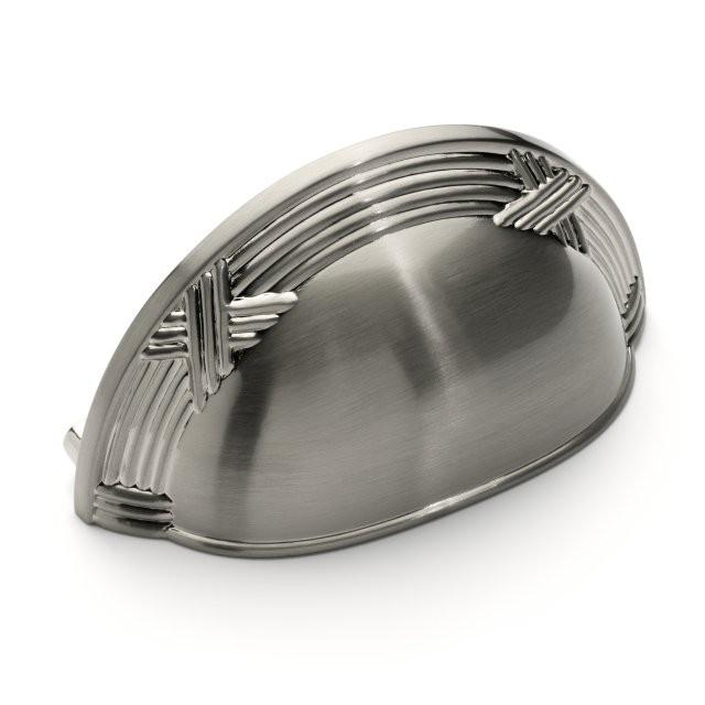 Drawer cup pull in satin nickel finish with lines and ribbon accent and three inch hole spacing 