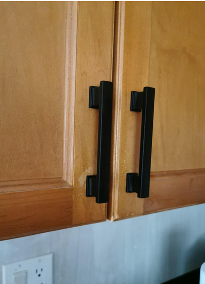 Cosmas 702-4FB Flat Black Contemporary Cabinet Pull on wood cabinet