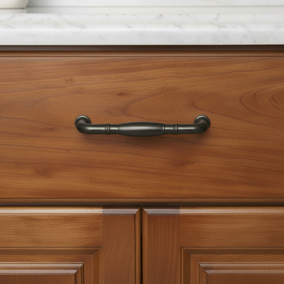 Wooden cabinet with a graphite gray handle on a white marble countertop