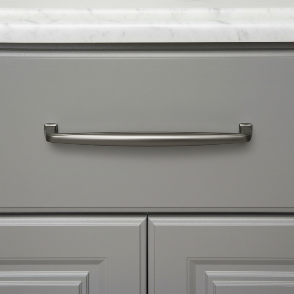 Gray cabinet with a solid metal graphite handle on a white marble countertop