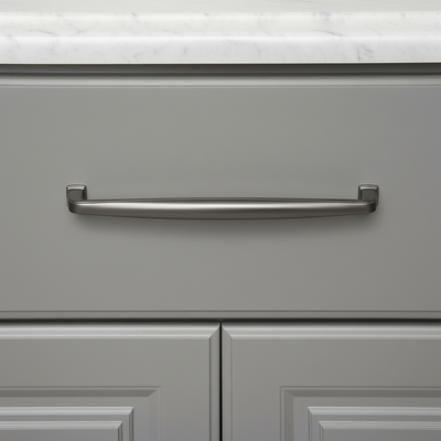 Gray cabinet with a solid metal graphite handle on a white marble countertop