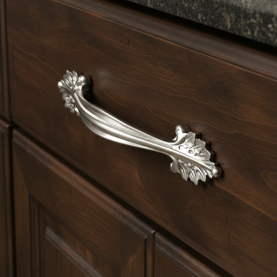 leaf cabinet drawer in satin nickel finish on a dark wood cabinet drawer