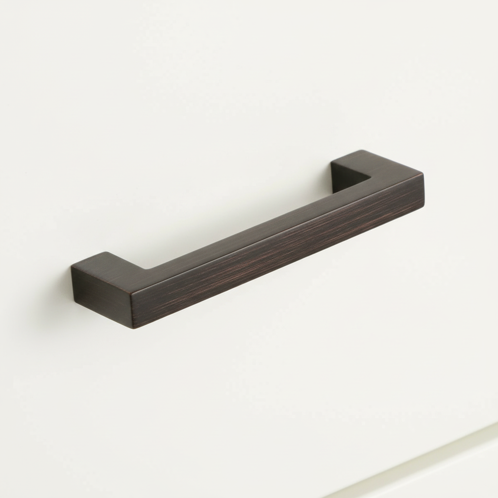 oil rubbed bronze square handle on a white drawer 