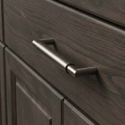 satin nickel cabinet handle on a wooden drawer