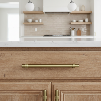 Wooden kitchen cabinet with brushed antique brass handle in a modern kitchen setting