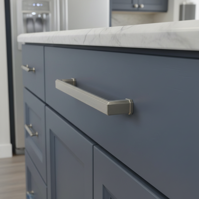 Close-up of a blue kitchen cabinet with a metallic handle