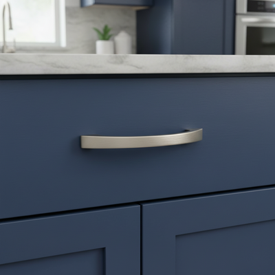 Blue kitchen cabinet with a silver handle in a modern kitchen setting