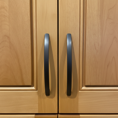Oil rubbed bronze cabinet pulls on wooden cabinet doors with modern handles 1:1 ratio

