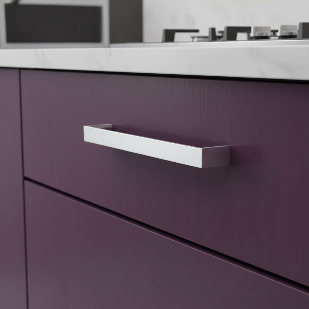A polished chrome cabinet pull with a sleek, modern design.