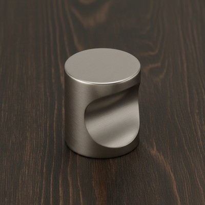 satin nickel cabinet knob installed on a wood drawer 