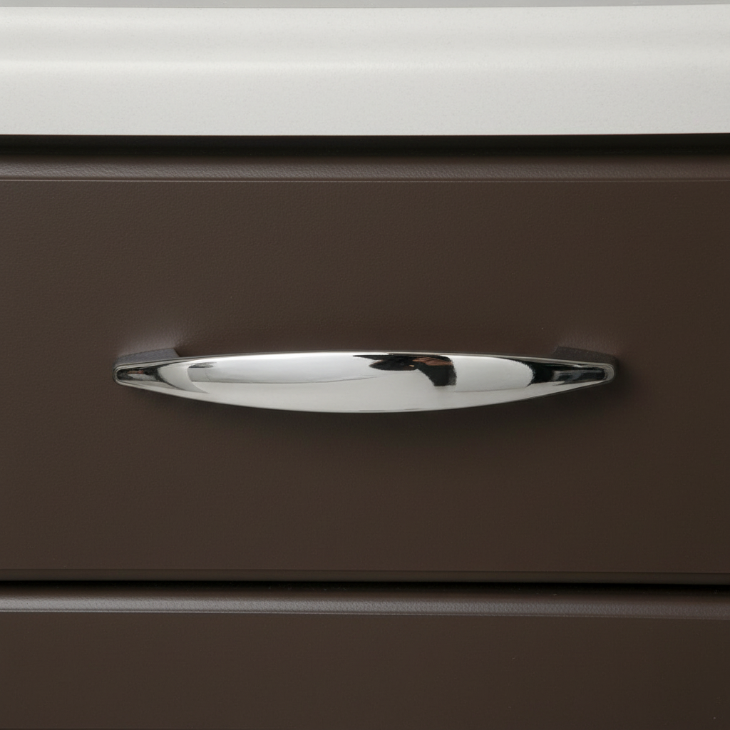 Chrome handle on a brown drawer with a white background