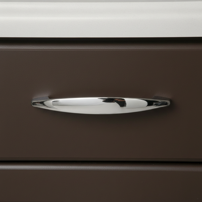 Chrome handle on a brown drawer with a white background