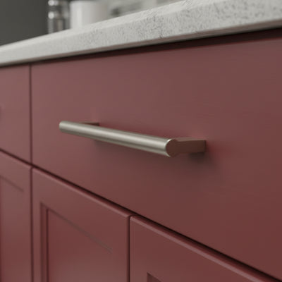 satin nickel solid metal cabinet handle on a cranberry cabinet drawer