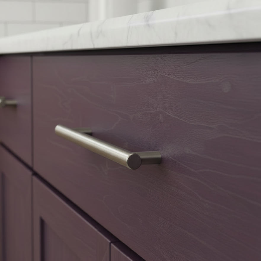 Close-up of a purple drawer with a silver handle in a kitchen setting.
