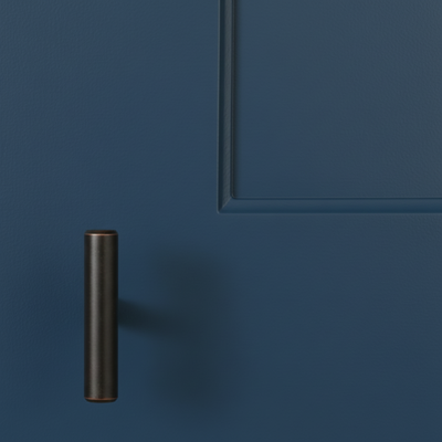 oil rubbed Bronze cabinet handle on a blue cabinet door