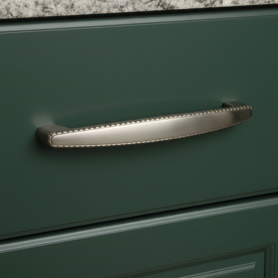 beaded cabinet handle satin nickel finish on a dark green cabinet drawer