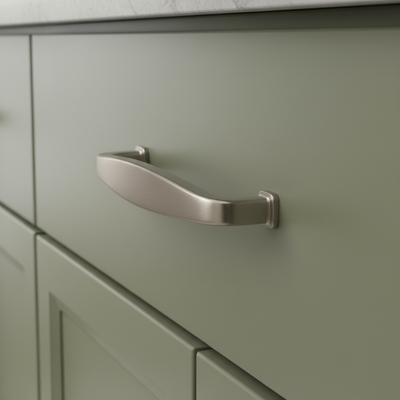 Metallic cabinet handle on a white background
