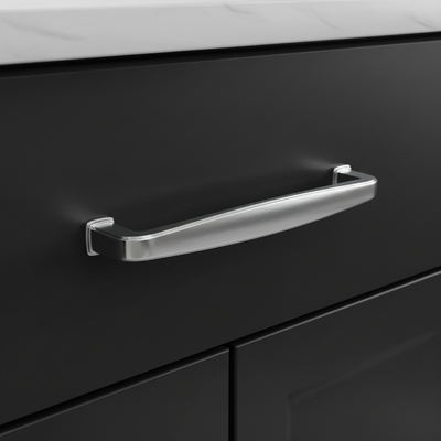Chrome cabinet handle on a black kitchen cabinet