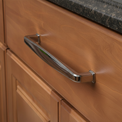 Wooden cabinet with a chrome handle on a wooden surface