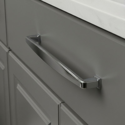 Subtle wide design drawer pull in polished chrome finish on gray kitchen drawer