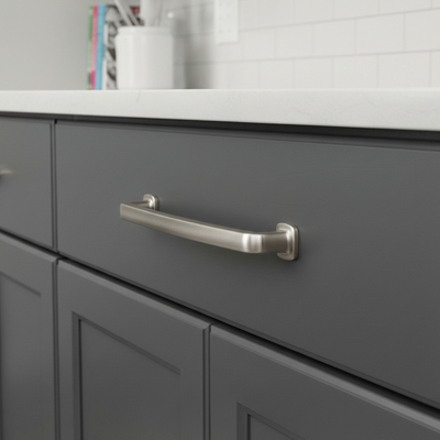 Gray cabinet with a satin nickel modern handle in a bathroom setting