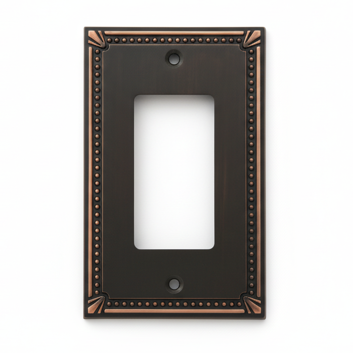 Decorative oil rubbed bronze wall plate with bronze trim on a white background