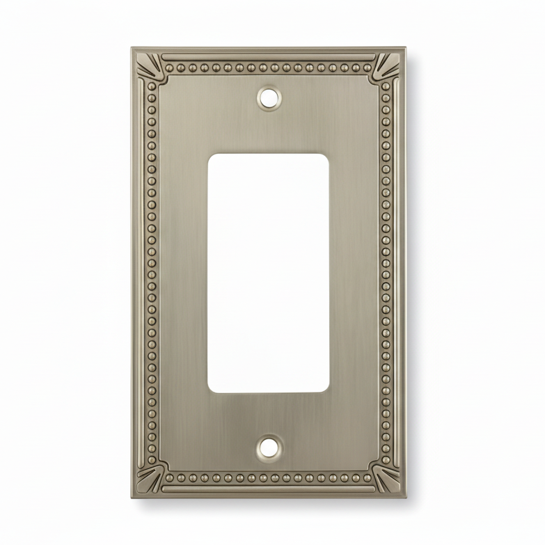 Decorative metal wall plate with beaded border on a white background