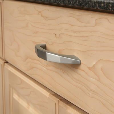 Close-up of a wooden cabinet with a metal handle