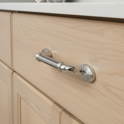 Chrome cabinet handle on a white background