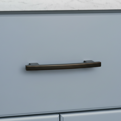 Blue cabinet with a oil rubbed bronze handle on a white background
