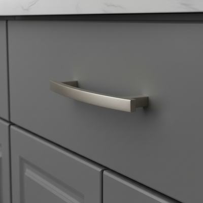 Gray cabinet with a metallic handle on a neutral background