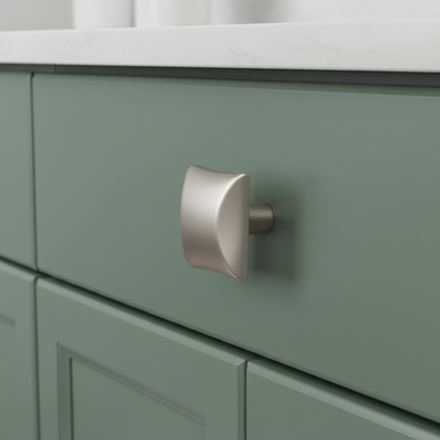 Close-up of a green cabinet with a silver knob