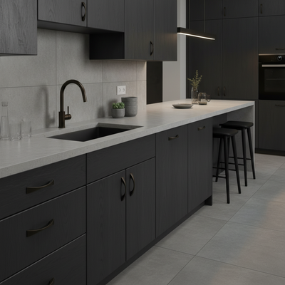 concrete counters and dark bronze cabinet knobs on a modern kitchen 
