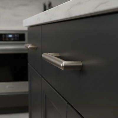 Close-up of a kitchen cabinet with metallic handle in a modern kitchen setting